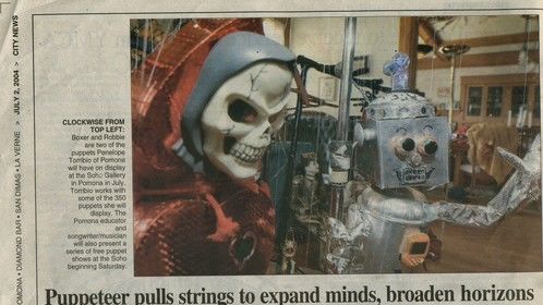 Penelope's puppets in news article.