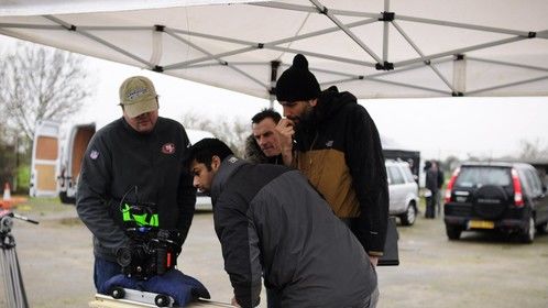 Reviewing a shot on the set of Game over with Director Adam Jenkins (R) and Cinematographers Werner Van Peppen and Sundeep Reddy (L)