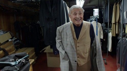 Legendary tailor Martin Greenfield trying on a jacket he made for basketball star Patrick Ewing. Frame grab from the film "Mr. Greenfield" by Rick Minnich. 
