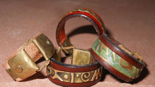 Leather rings with embossed metal